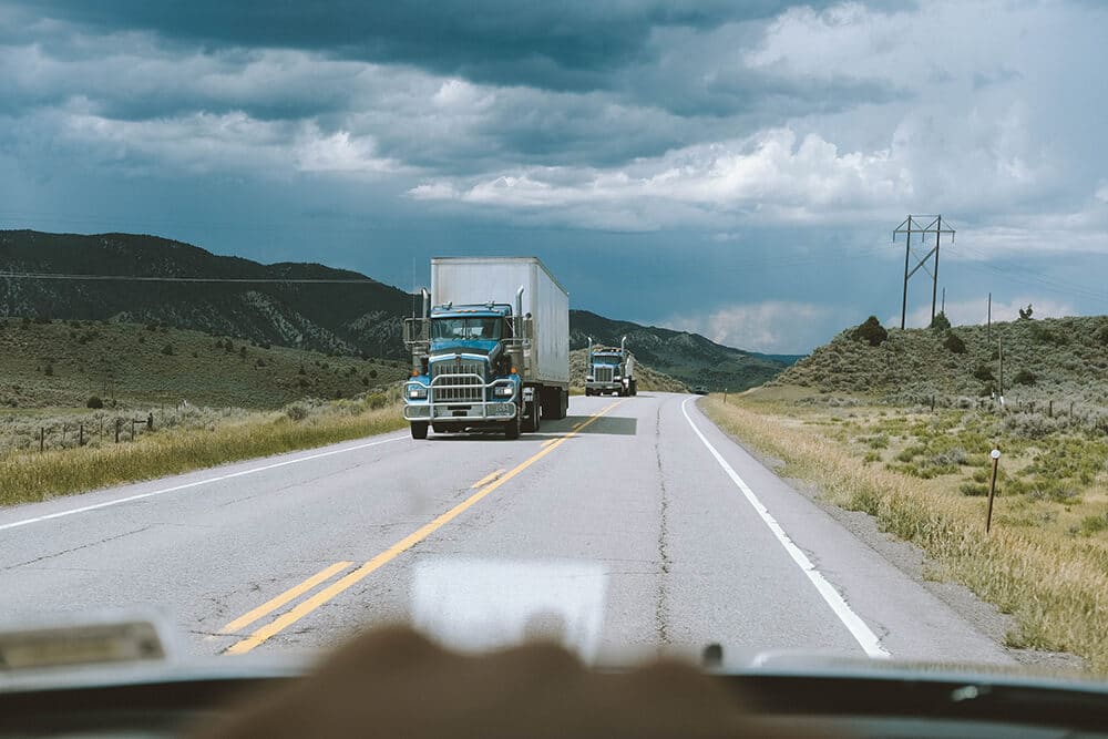 Driver perspective sees truck on road 