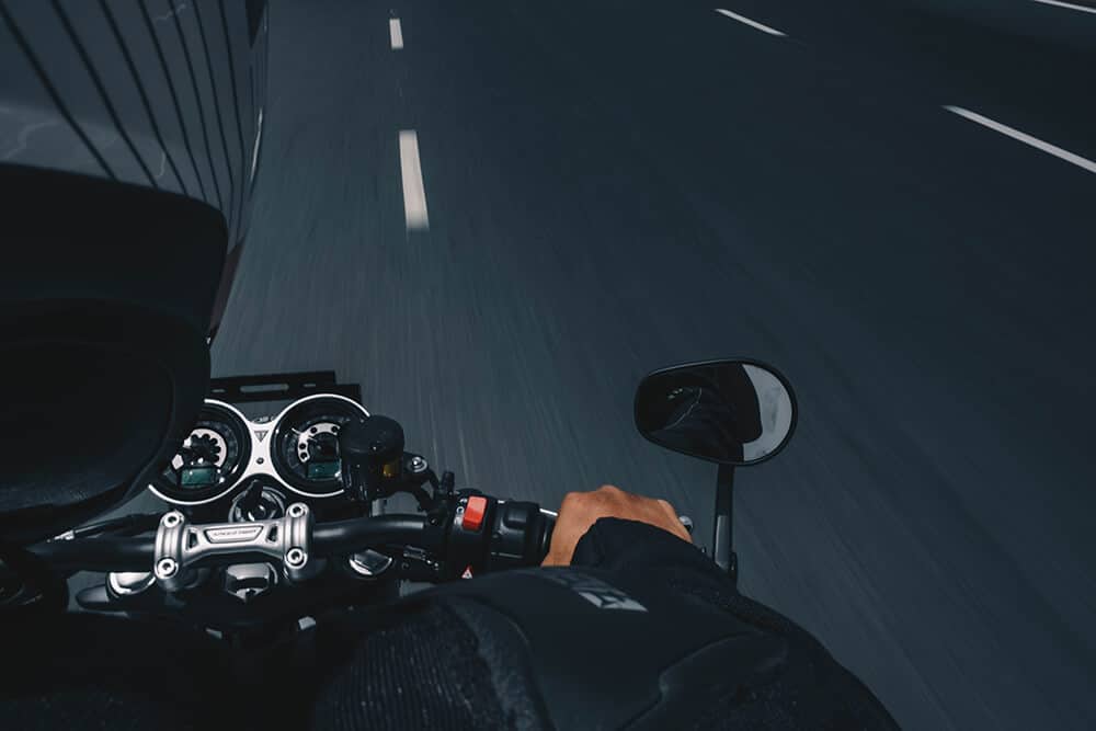 View over motorcycle rider's shoulder