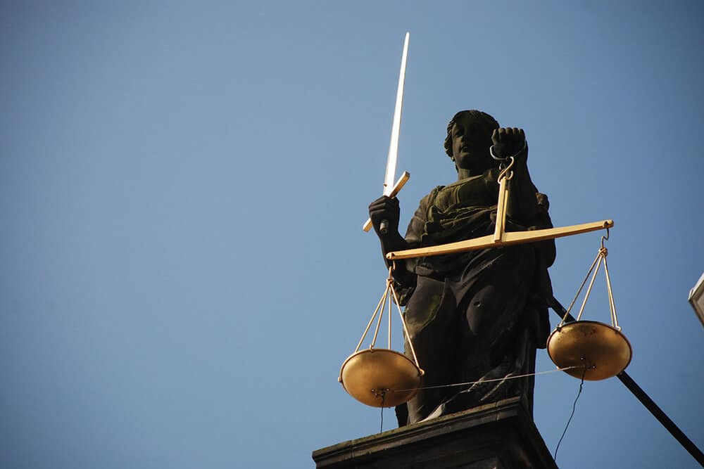 Statue of Lady Justice holding sword and scales