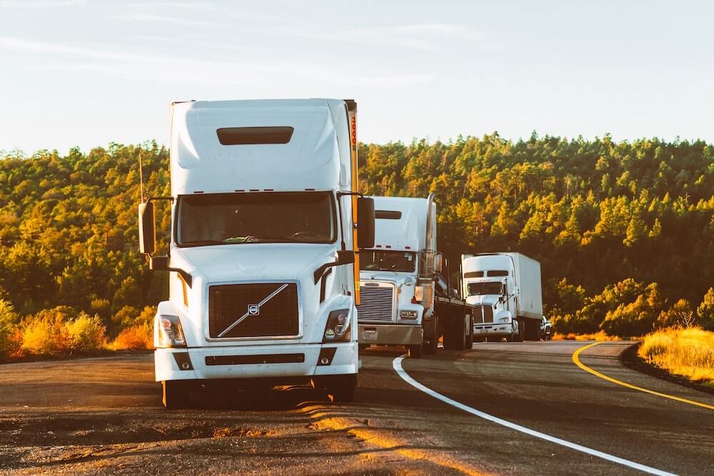 trucks parked on the side of the road